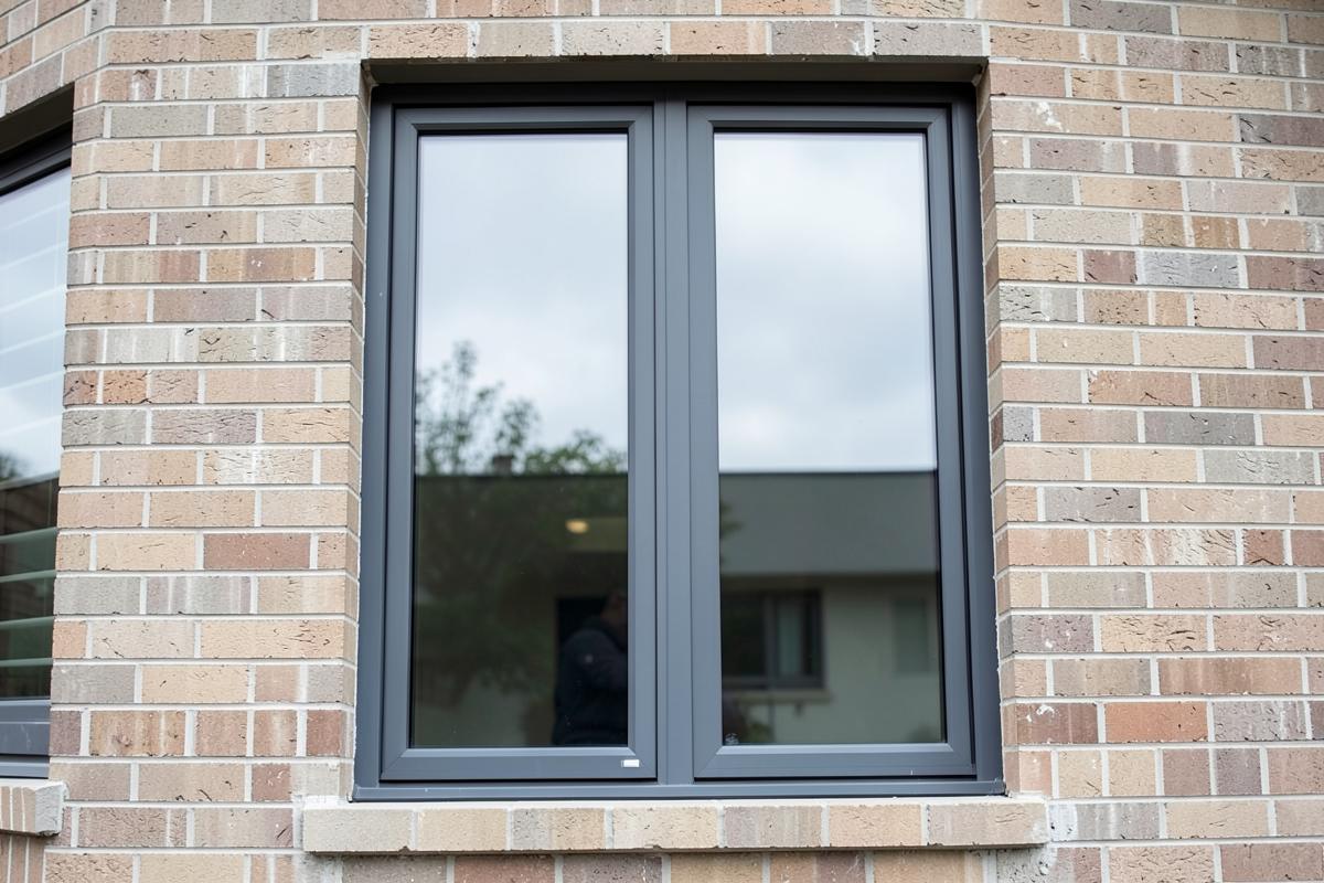 Same brick window opening with new clear glass after repair